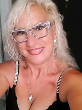 Ravishing lady is spreading her pussy lips on photo