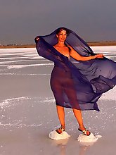 Beautiful sunset scenery by a shawl on a salt lake
