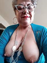 Big breasted mature prostitutes are fingering themselves