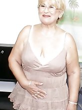 Erotic mature whores getting nude on photo