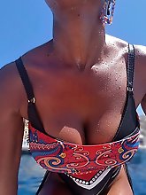 A stunning woman of a certain age poses for a series of explicit photos in which she opens her vagina.