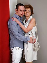 Naughty mature lady playing with her toy boy