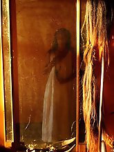 An amazing old lady is posing almost naked in stunning shots