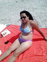 Elegant dame playing with her pussy