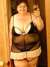 Elegant mature mamas are posing seminaked in public